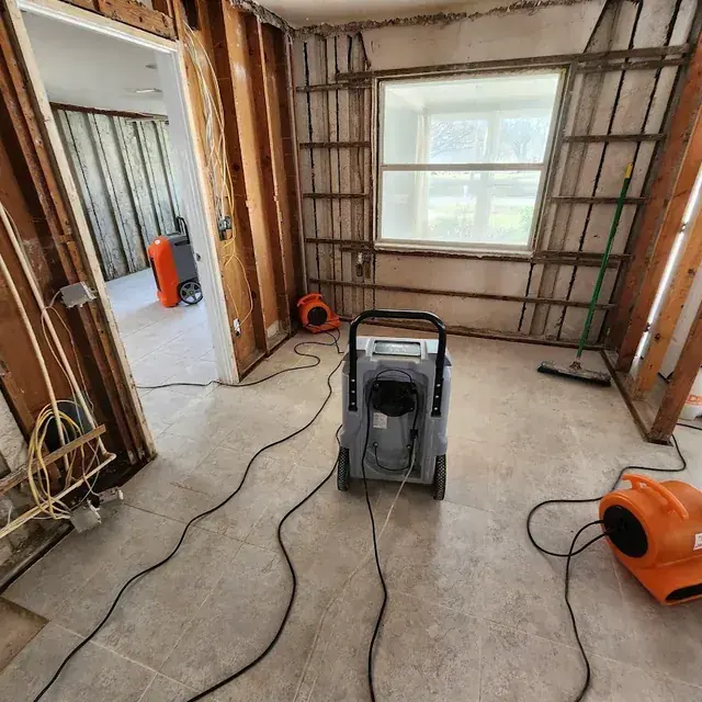 Standing water across a tile floor in a Miami, FL home