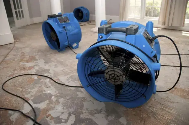A dehumidifier running during dry-down in a Miami, FL home