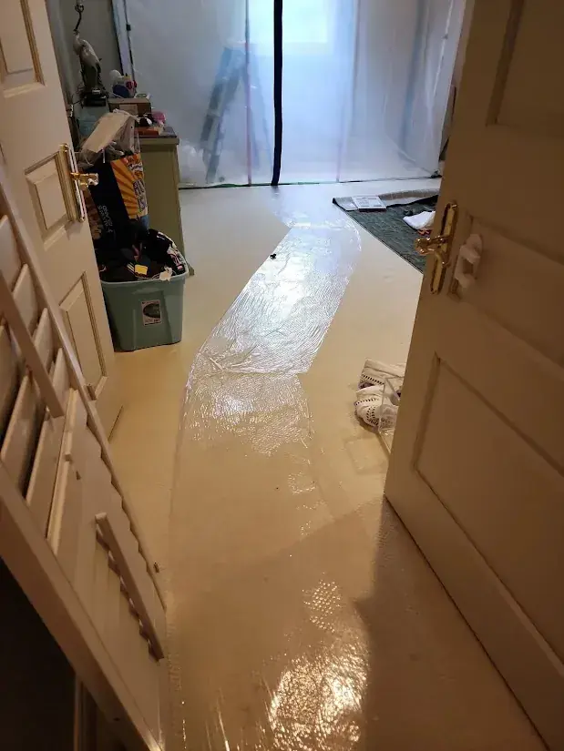 Extracting standing water from a flooded room in a Miami, FL home